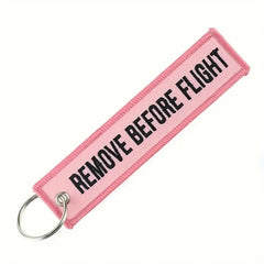 Remove Before Flight Pink Keychain